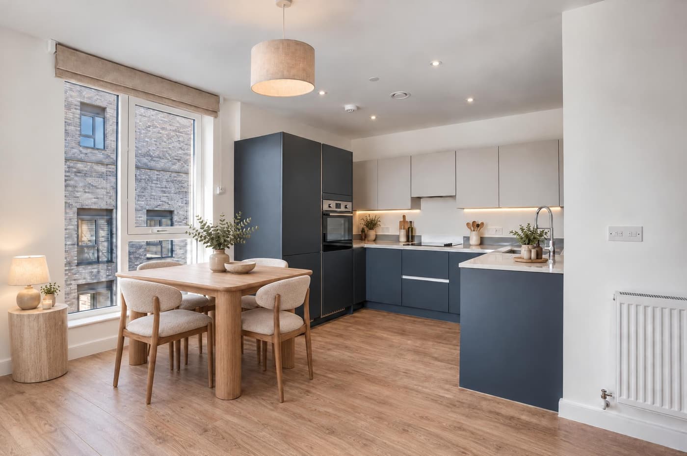 A staged kitchen and dining area