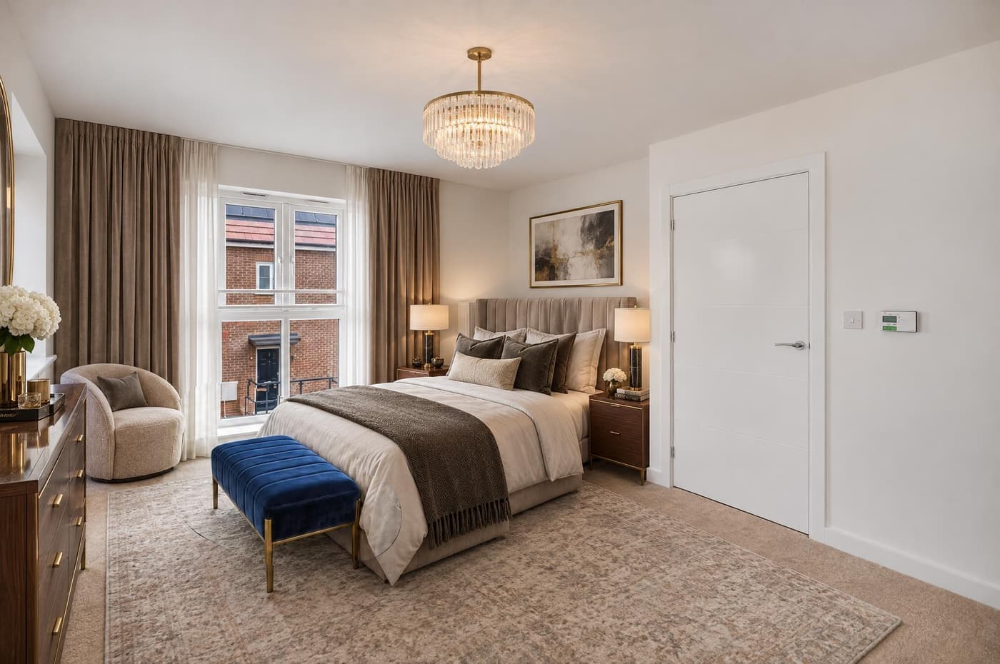A staged principal bedroom
